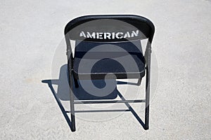 Metal Folding Chair. A classic black metal folding chair. Folding chairs are used for all types of events and gatherings. They