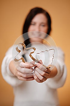 Metal forms for baking gingerbread for christmas blurred woman hands.