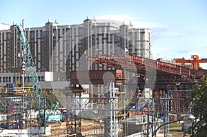 Metal frame of an automobile overpass next to the existing railway line, Moscow