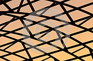 Metal frame of a canopy at sunset