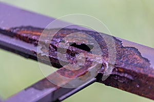metal frame with hole corroded by water