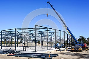 Metal frame of a modern industrial building in the construction process