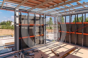 Metal frame of newly built building. Construction of a new tiny house. Selective focus