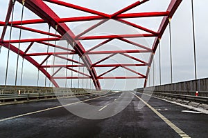 Metal frame structure of a bridge over a highway road