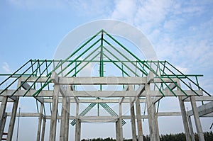 A new build roof with a metal truss framework , color green