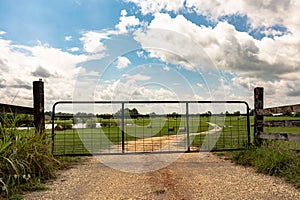 Metal gate on dirt road