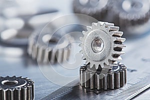 metal gears and bearings. Background with part of the mechanism