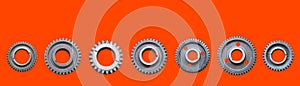 Metal gears isolated on lush lava background collage. Steel industrial gears banner with copy space for text.