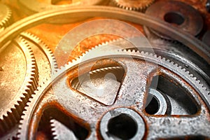 Metal gears of the old mechanism, macro blurred background, rusty,  corrosion