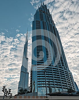 Metal glass and concrete giant massive of Burj Khalifa and the neighbour building