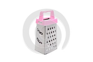 A metal grater with a pink plastic handle for chopping food and vegetables when cooking. Close-up studio shot isolate