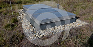 metal grates and a hatch on the roof garden.