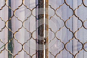 Metal grating on a closed window photo