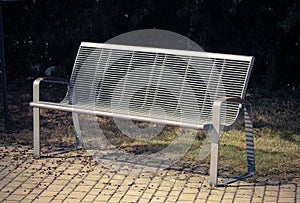 Metal bench on the sidewalk