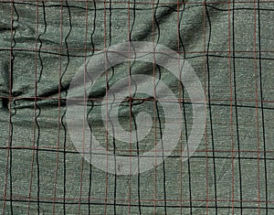 Metal grid fence with old tilt.