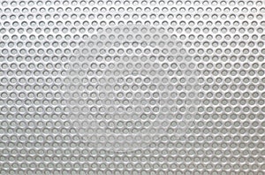 Metal grille with holes. Macro background