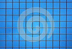 metal grille with square cells on a blue background