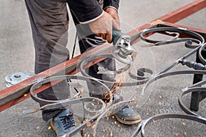 Metal grinding with angle grinder. Sparks fly on the sides.