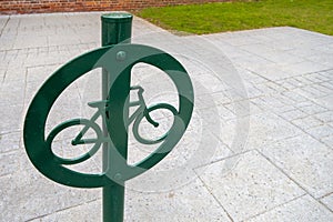 Metal in-Ground bycycle lock Mount post with circle, bike icon and green Coat Paint