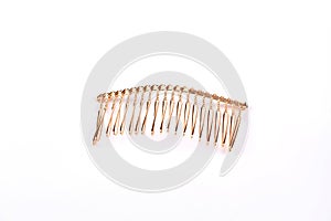 Metal hair comb on white background.