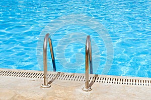 Metal hand railing of staircase to public swimming pool