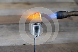 Metal heating with a gas burner in a home workshop. Tempering st