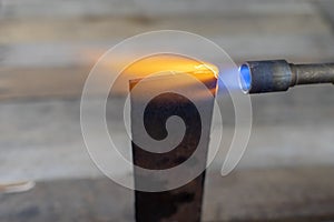 Metal heating with a gas burner in a home workshop. Tempering st