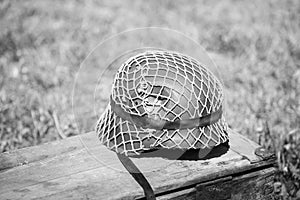 Metal Helmet Of Infantry Soldier Of Wehrmacht, Nazi Germany Of World War II On Old Wooden Box