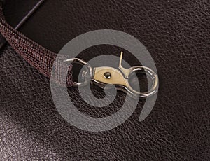 Metal hooks on the leather pouch close-up