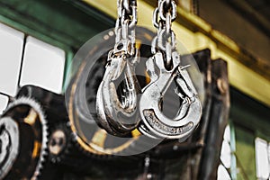 Metal industrial chains with hooks in the workshop of a metallurgical plant