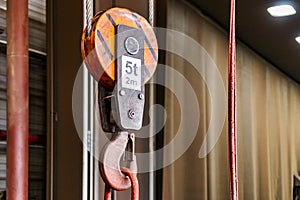 Metal industrial chains with hooks in the workshop of a metallurgical plant. Close-up. Lifting hooks for lifting heavy materials