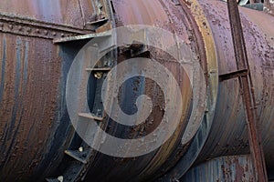 Metal industrial pipe with gaskets, rivet construction, rust patina