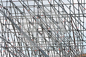 Metal industrial scaffolding construction site structure white grey overcast background