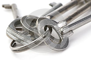 Metal keys close-up on white