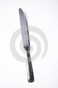 Metal knife on white backround