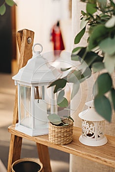 Metal lantern for candles, as well as elements of rustic decor in the decor of a wedding or home