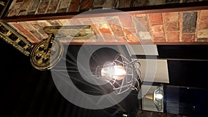 metal lantern with a lamp inside. loft lamp. Calm, meditation, retro style. Decor, Beautiful design of a bar, restaurant