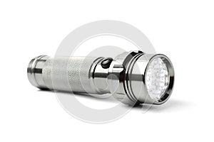Metal LED flashlight on a white background, isolate