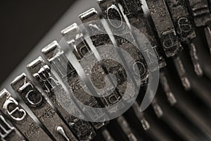 Metal letters on typewriter