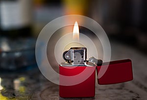 Metal lighter with flame