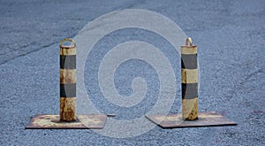 Metal limiters of motion on the pavement