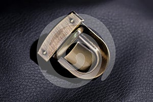 Metal lock on a black background. Fittings for accessories.