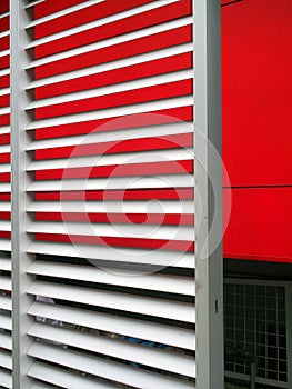 Metal Louvres and Red Wall photo