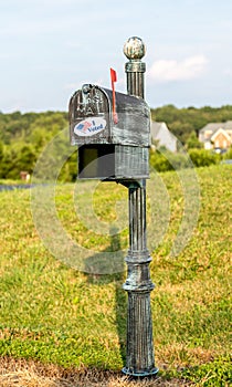 USPS metal mailboxes for rural homes with I voted sticker for vote by mail photo