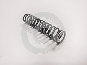 Metal mainspring on a white background