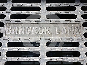The metal manhole cover at the Bangkok, Thailand. Bangkok land.