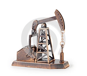 Metal mechanical miniature oil derrick isolated photo