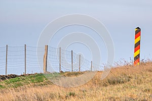 Metal mesh fence on the Polish-German border, serving as a limitation of the spread of ASF disease -
