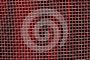 Metal mesh grid pattern in red tone.