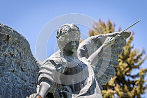 Metal Micheal the Archangel With Wings and a Sword Christian Statue at Cemetery